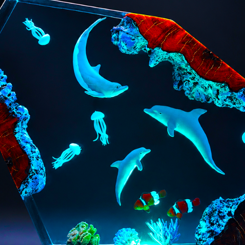 Aquarium scene with glowing dolphins, jellyfish, and coral.