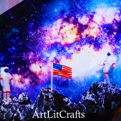 Two astronauts on a moon surface with an American flag, set against a colorful space background. Brand 'ArtLitCrafts' visible.