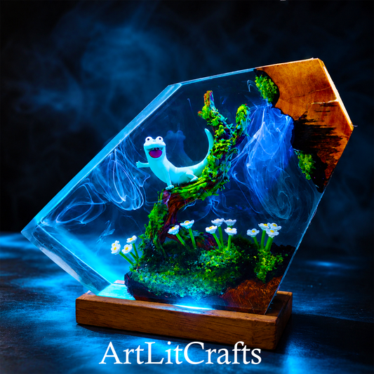 Decorative light box with a cartoon lizard character, plants, and flowers on a dark background with 'ArtLitCrafts' branding.