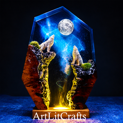 wolf resin artwork with moonlit canyon landscape and celestial sky