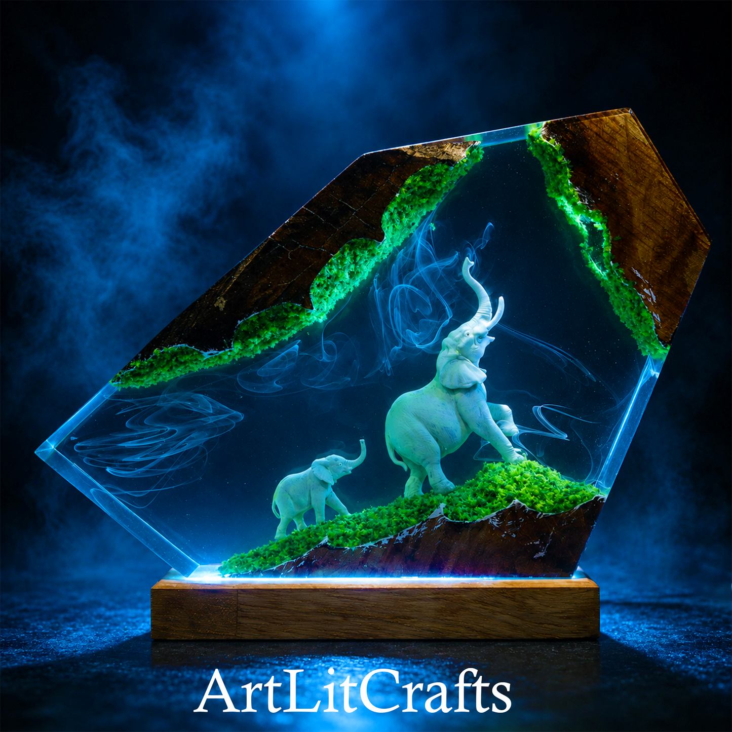 resin lamp showing elephant family walking through moss-covered terrain and 'ArtLitCrafts' branding