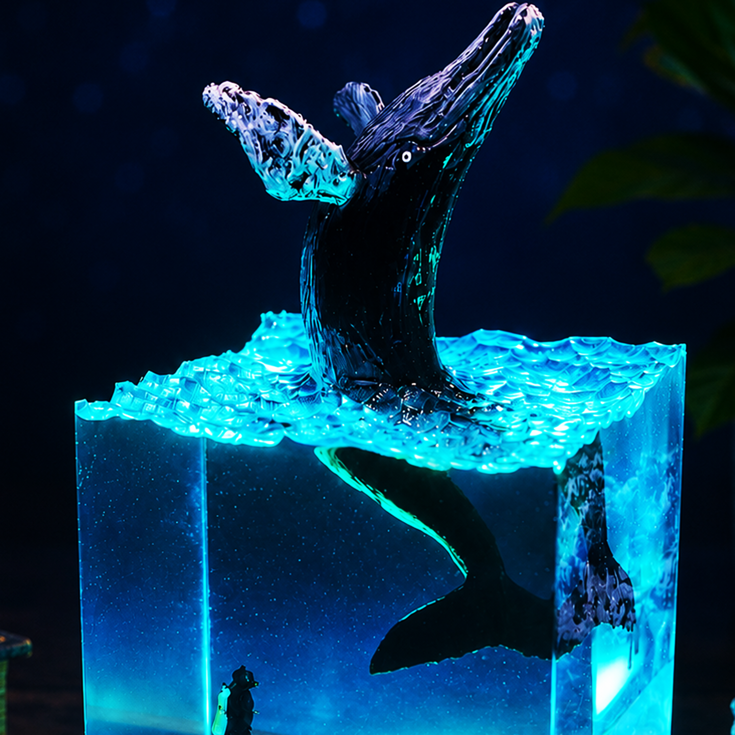 Close-up of breaching whale details inside handmade ocean resin lamp