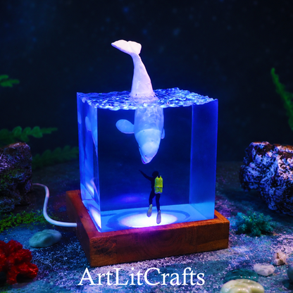 beluga whale and diver epoxy resin lamp front display, featuring 'ArtLitCrafts' branding.