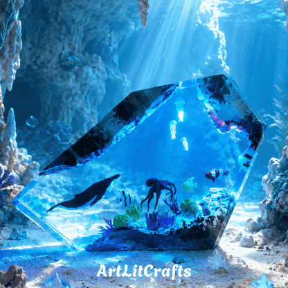 Handmade whale and octopus epoxy resin lamp with glowing underwater coral reef scene