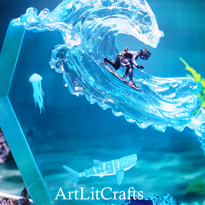 Decorative wave sculpture with a surfer, jellyfish, and shark, featuring 'ArtLitCrafts' branding.