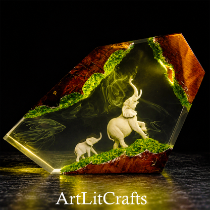 Epoxy resin lamp feature elephants and greenery, featuring the brand 'ArtLitCrafts'.